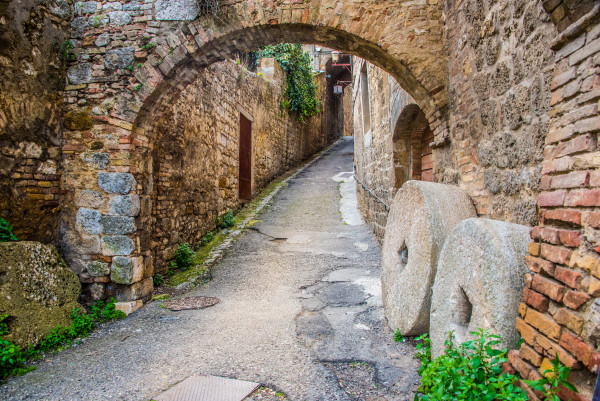 Ancient Millstones on the Pathway - San Gimignano, Italy by Jenny Nordstrom