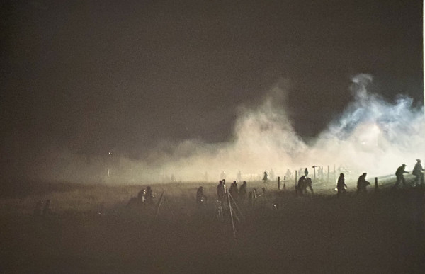 Running from the Tear Gas, Rubber Bullets, Water Canons, etc. Nov 20th 10 Hour Stand Off with Police, Backwater Bridge Rt #1806, ND by Jon Willis
