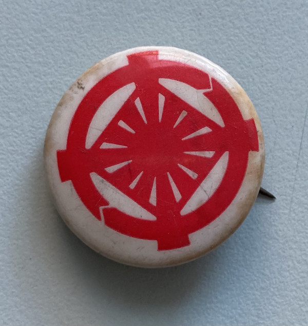 White button with red design by misc. unknown