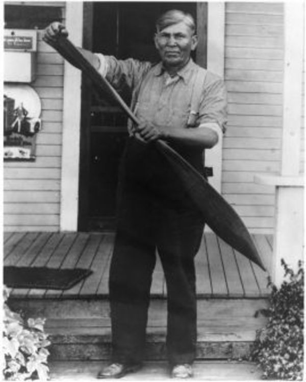 Joe Johnson with a paddle, 1920 by Charlotte Watts