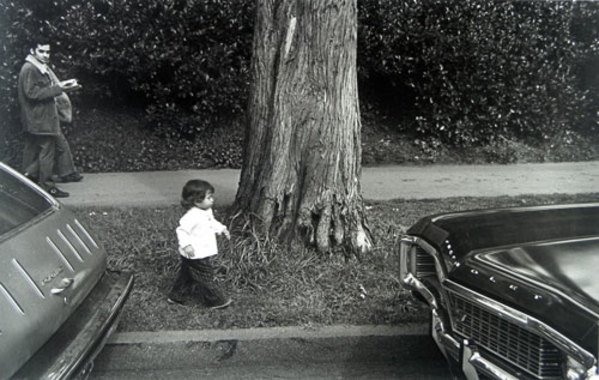 Little Girl Between Cars by Alan Hoffman