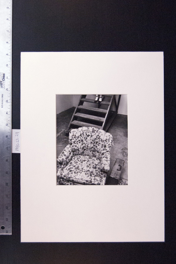 Untitled 1972 (Armchair, suitcase, stairs, feet) by Leland Rice