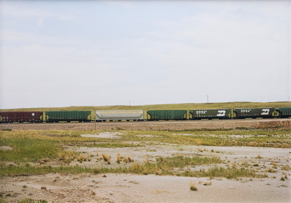 Untitled (Red, green, silver train cars, Upton, Wyoming) by Victoria Sambunaris