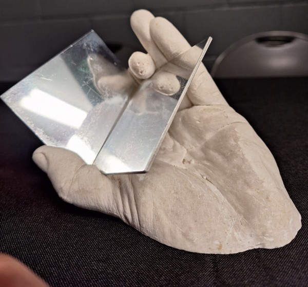 Hand Holding Polished Metal Sculpture 3-D by Hans Breder
