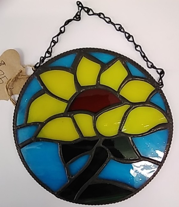Sunflower with blue background, chain to hang by Craig Wills