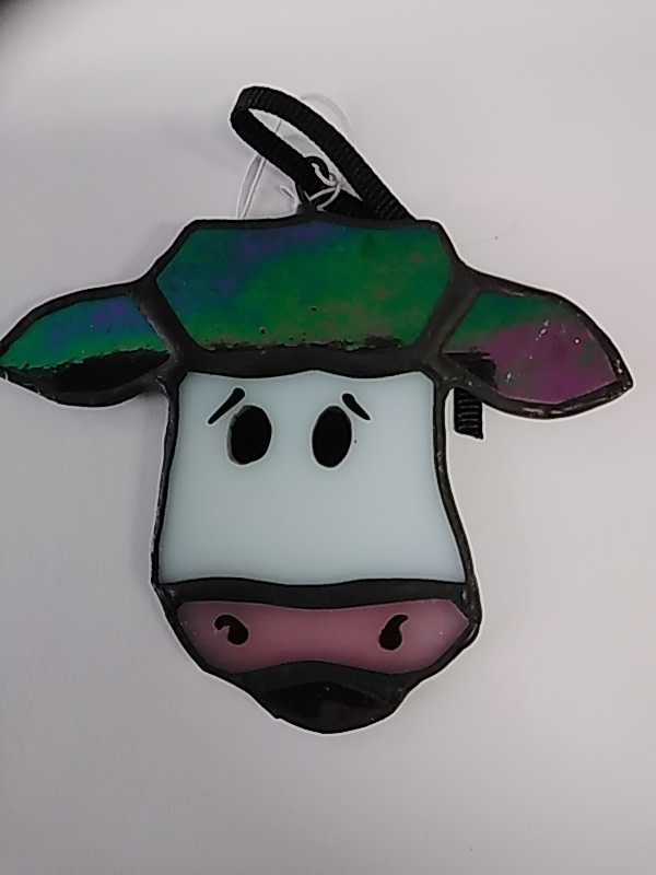 cow face with green ears by Craig Wills