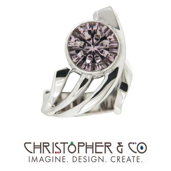 CMJ D 21080 White Gold Ring designed by Christopher M. Jupp set with concave cut amethyst cut by Richard Homer.