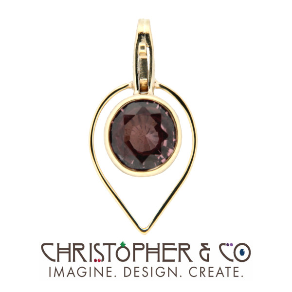 CMJ F 13020    Gold element set with spinel designed by Christopher M. Jupp.