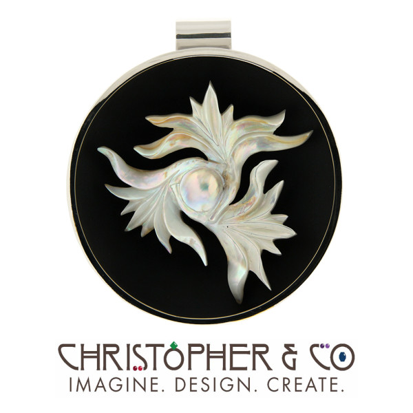 CMJ G 22005   White gold and silver pendant designed by Christopher M. Jupp & set with carved pearl by Darryl Alexander.