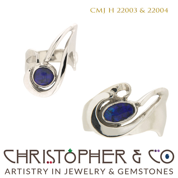CMJ H 22003 & 22004  White gold wedding rings designed by Christopher M. Jupp and set with black opal cabachon. by Christopher M. Jupp