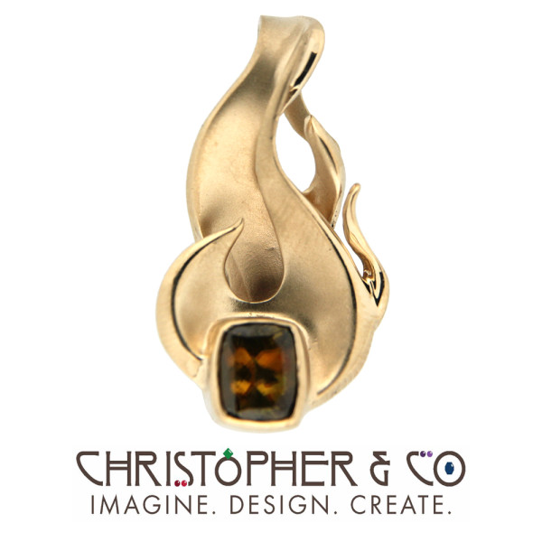 CMJ R 13011    Gold pendant set with sphene designed by Christopher M. Jupp.