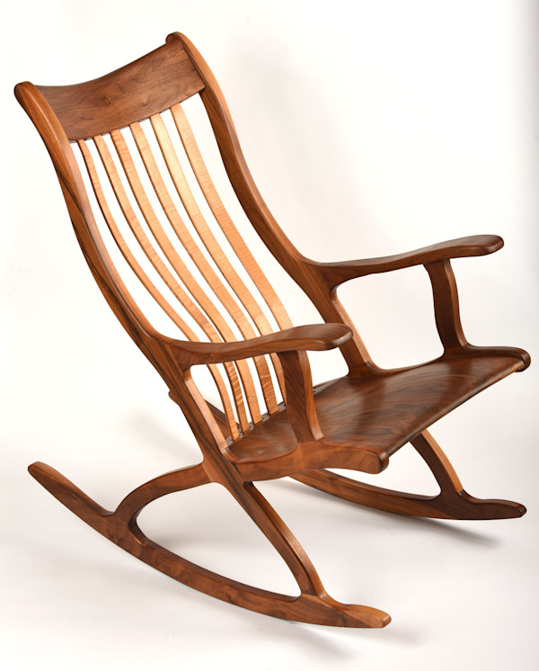 Patented cantilever seated ergonomic walnut rocking chair by Robert Bragg, Image 1.