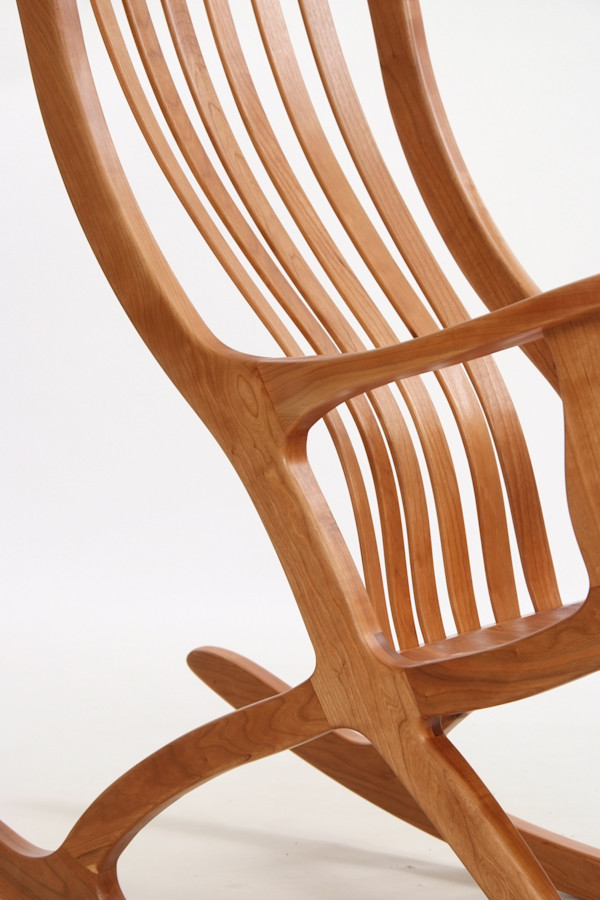 Patented cantilever seated ergonomic cherry rocking chair by Robert Bragg, Image 1.