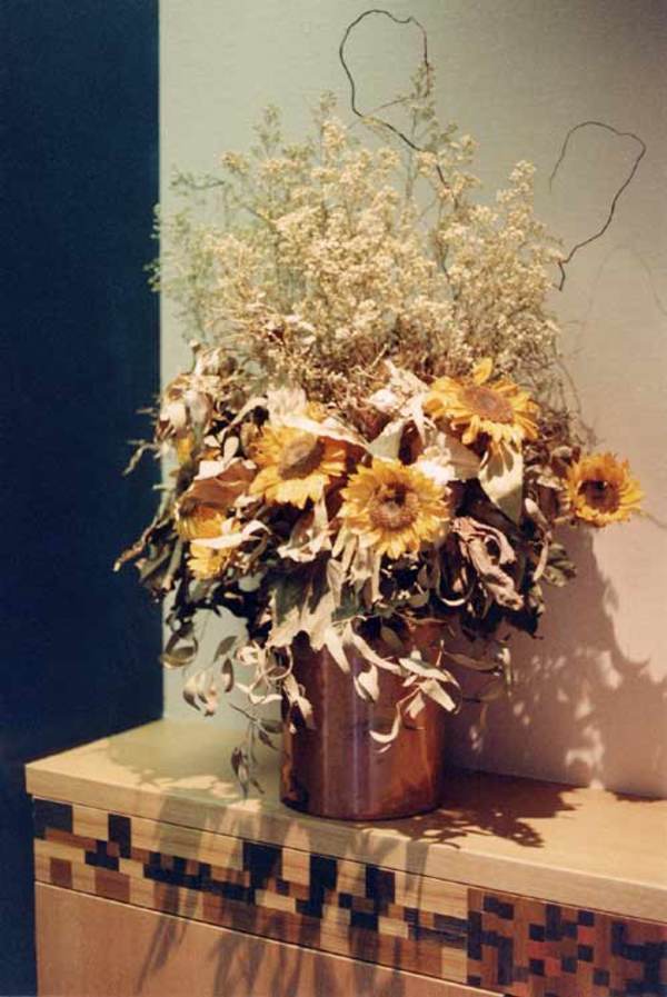 Sunflowers and Cabinet at end of Hallway by Eve Mero