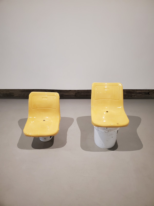 Two Seats, Two Buckets by Abed Elmajid Shalabi