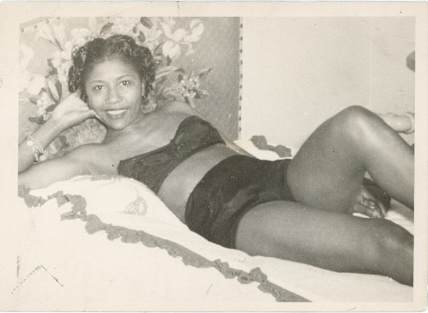 Woman reclining in underwear by Unknown