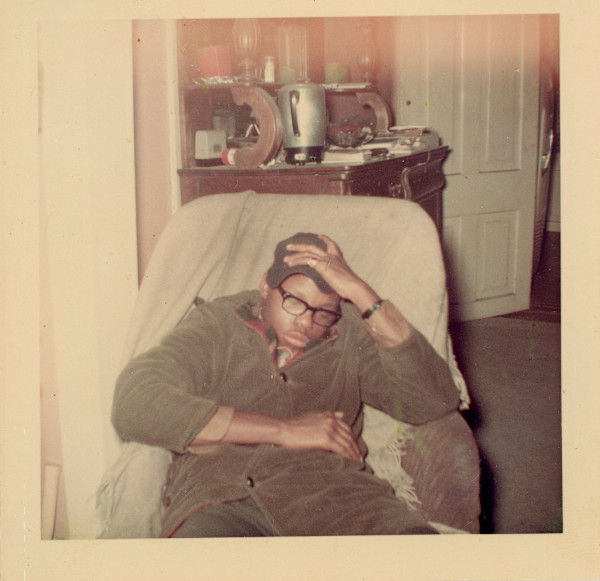 Young man slouched in chair by Unknown