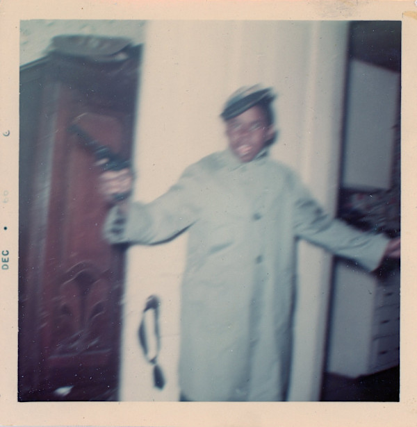 Young man wielding pistol by Unknown