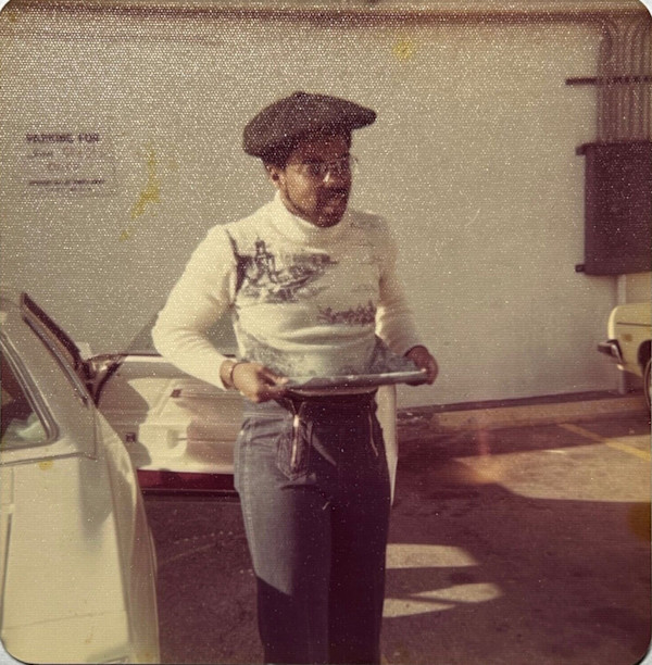 New Year (man tugging on sweater) by Unknown