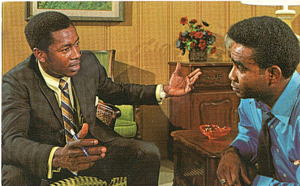 Two men talking by Unknown