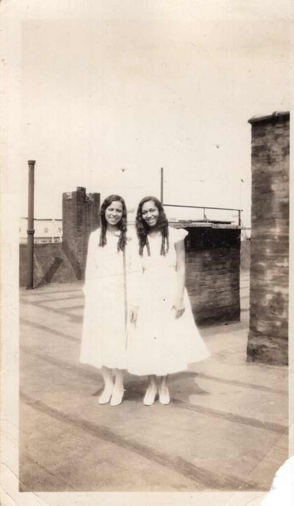 Two girls with long curls by Unknown