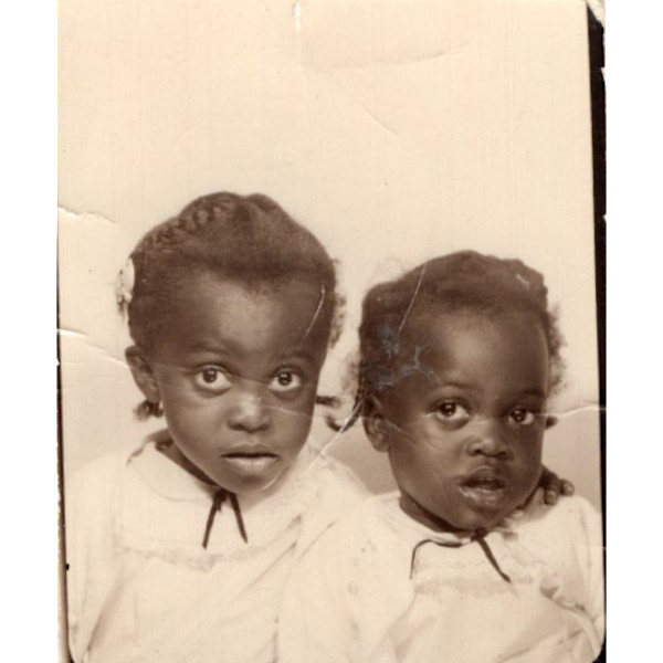 Two toddler sisters by Unknown