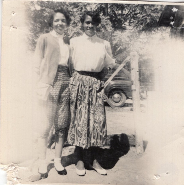 Two young women outdoors by Unknown