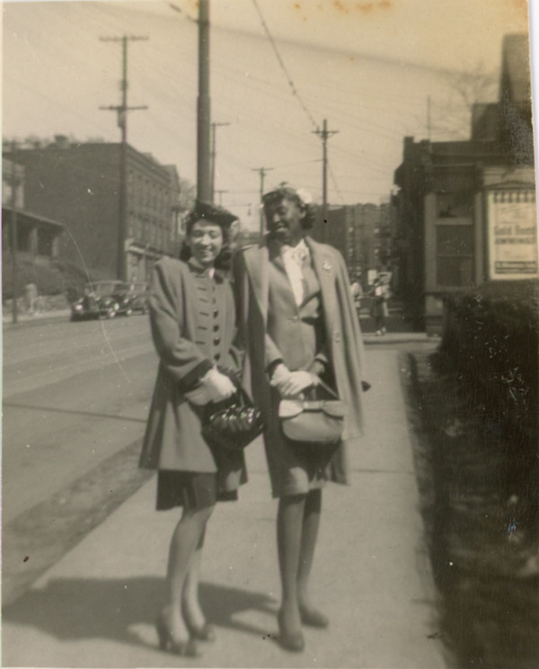 Two women standing on the street, Pennsylvania by Unknown, Filmet Photo Service