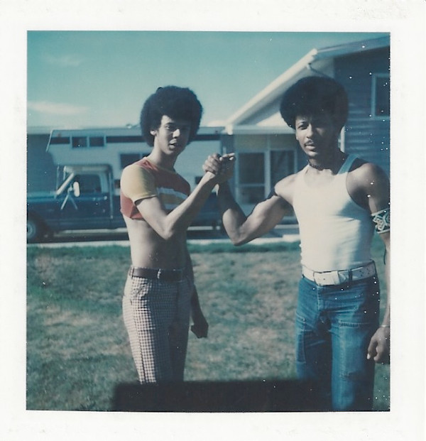 Two men clasping hands by Unknown