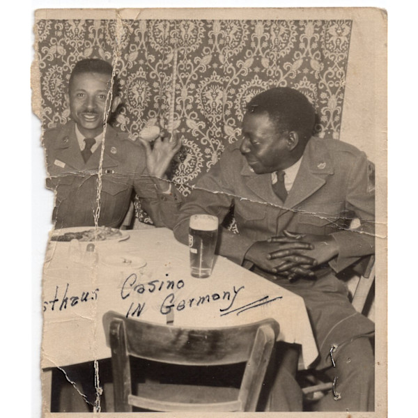 Two soldiers in ___sthaus casino, Germany by Unknown