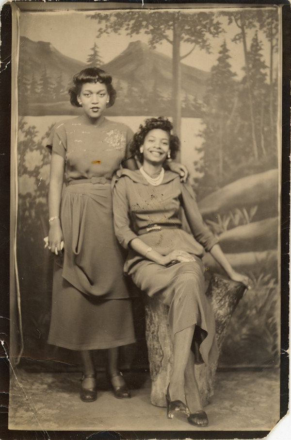 Two women with mountain backdrop by Unknown