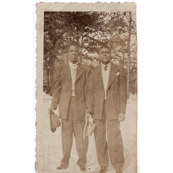 Two men holding hats by Unknown