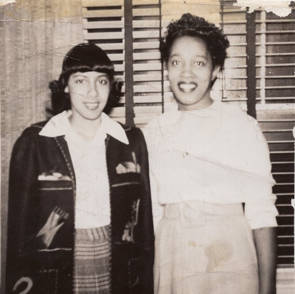 Two women, one in embroidered Mexican jacket by Unknown