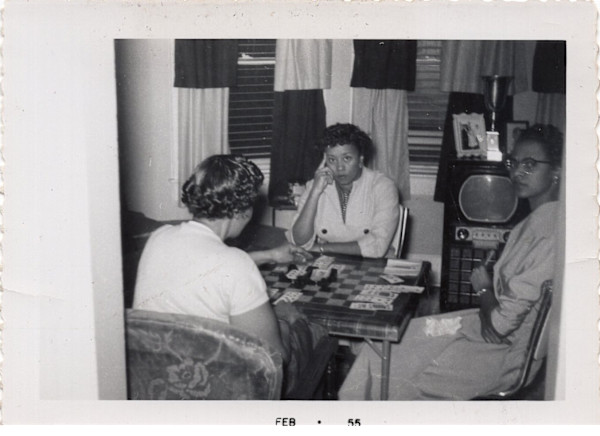 Three women playing cards by Unknown