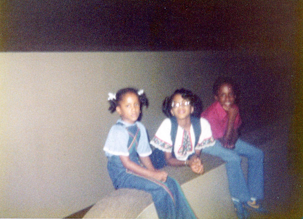 Three kids hanging out by Unknown