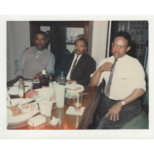 Three men at the dining table by Unknown