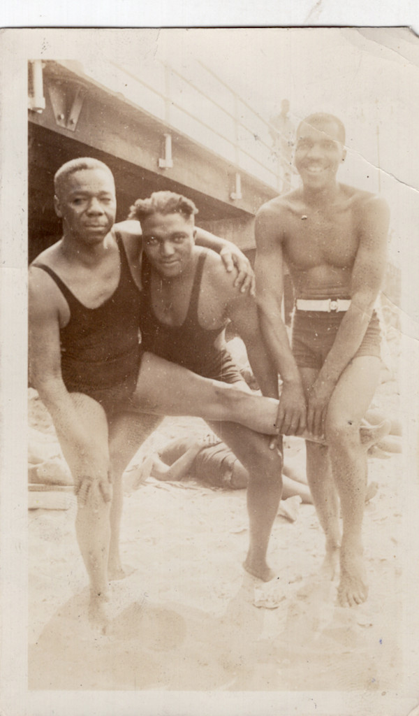 Three men at the beach by Unknown