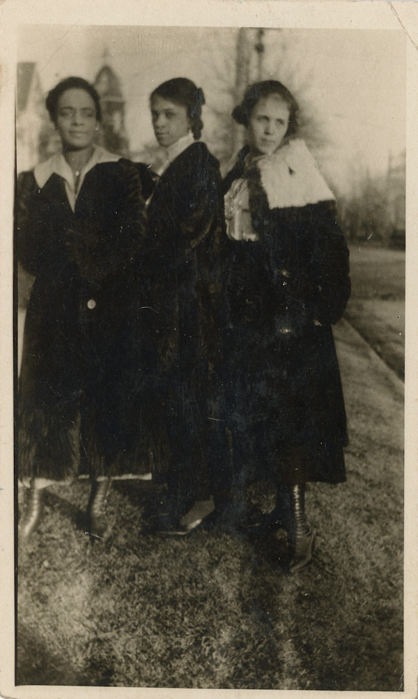Three women in overcoats by Unknown