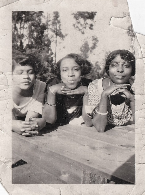 Three women posing by Unknown