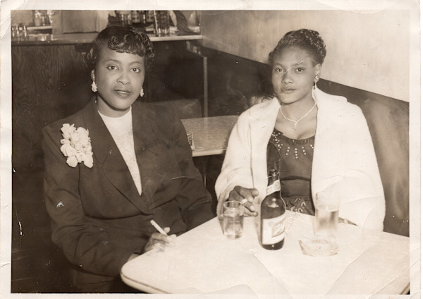 Two women in a booth by Unknown