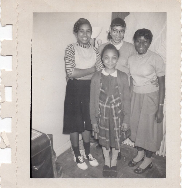 Four smiling schoolgirls by Unknown