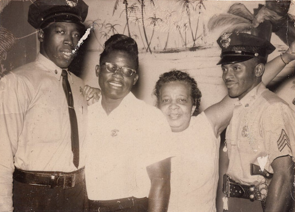 Foursome with two officers by Unknown