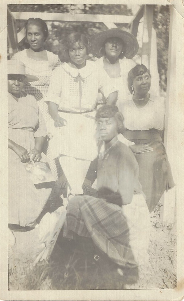 Six women posing by Unknown