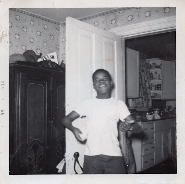 Boy playing air guitar by Unknown