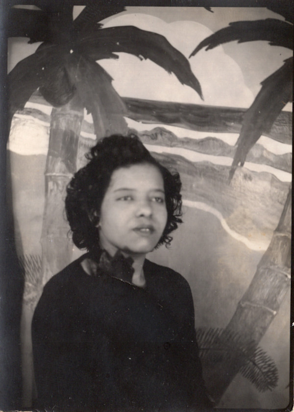 Arcade portrait of young woman with beach backdrop by Unknown
