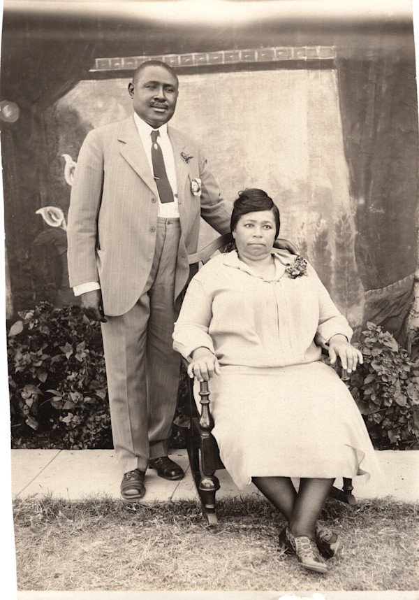 Stately couple in makeshift outdoor studio by Unknown