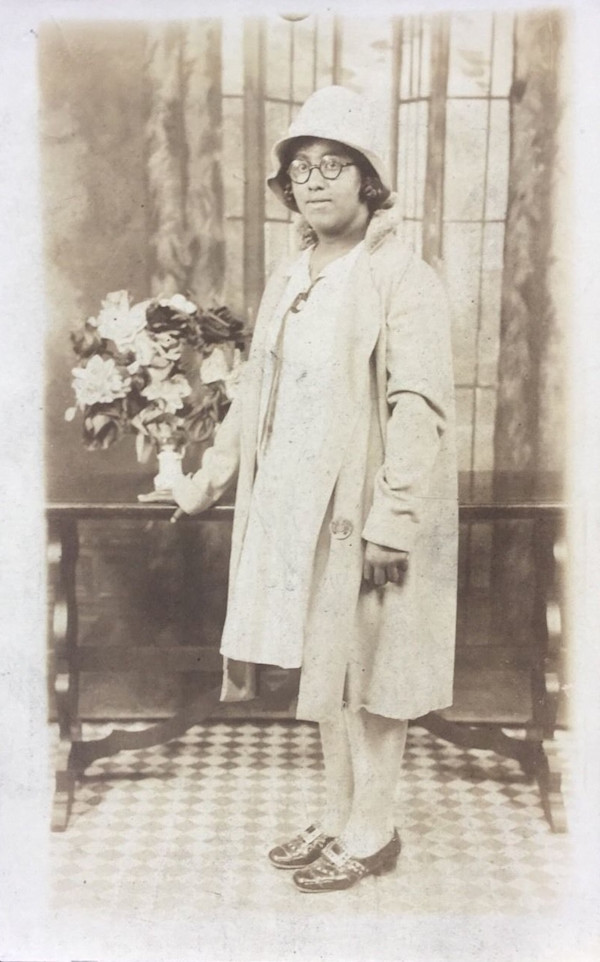 Girl in glasses and cloche hat by Unknown