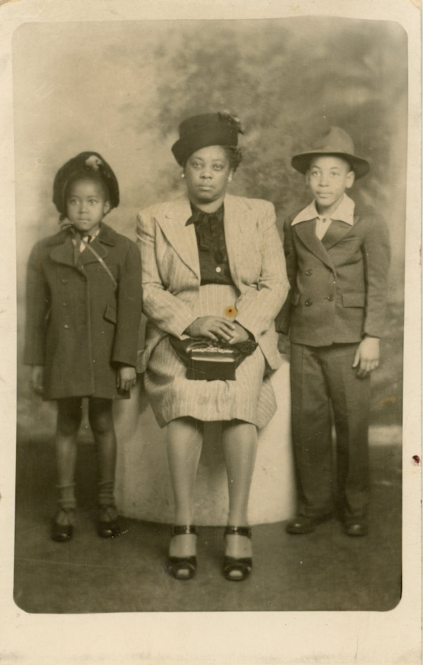 Seated woman with two children by Unknown