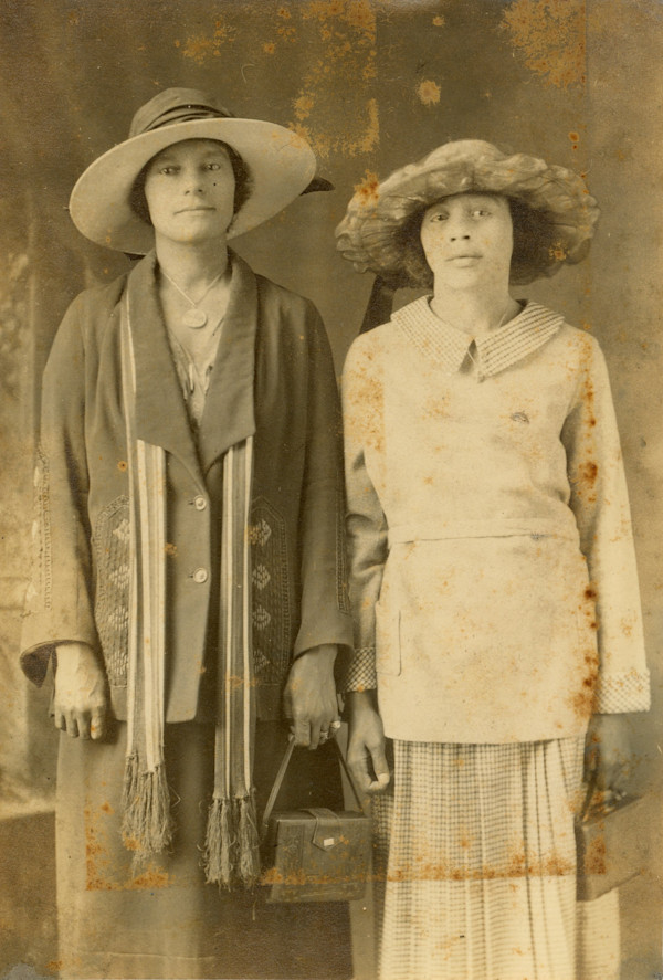 Two well-dressed young women by Unknown