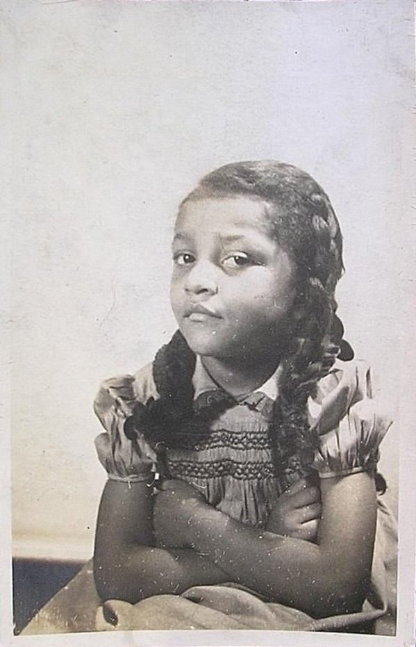 Girl with folded arms by Unknown